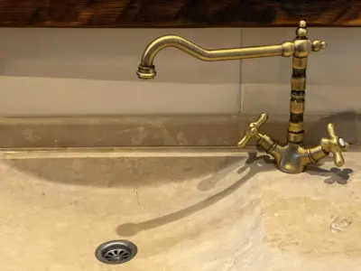 brass water tap installed in bathroom