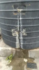 amaged water tank with cracks and leaks