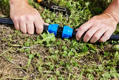 PP compression fitting installed on HDPE pipe showing nut, grip ring and O-ring sealing mechanism for leak-proof water connection